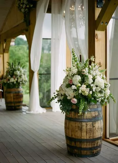 Wine-Barrels-Decorated-With-Colorful-Flower-Bouquets